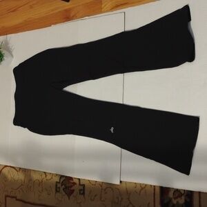 ALO Yoga Flare Leg Leggings. Women's size Small. Black in color.